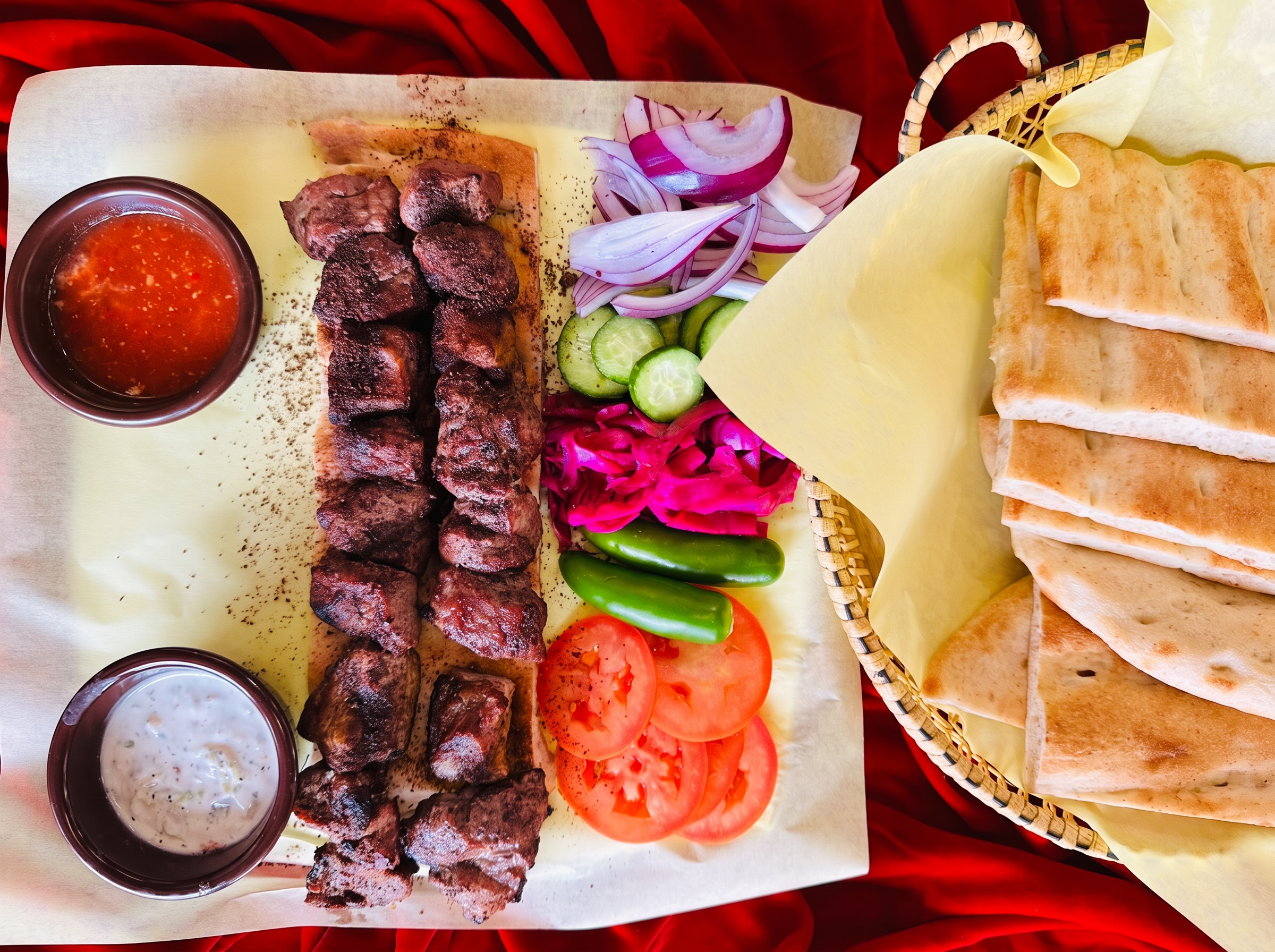 Chicken kabob skewers over saffron rice